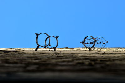 Close-up of bicycle against clear sky