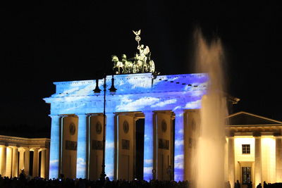 Low angle view of built structure at night