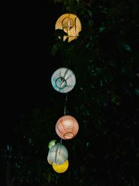 Close-up of lantern hanging at night