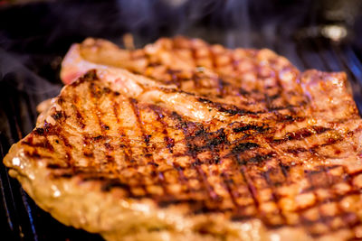 Close-up of meat on barbecue grill