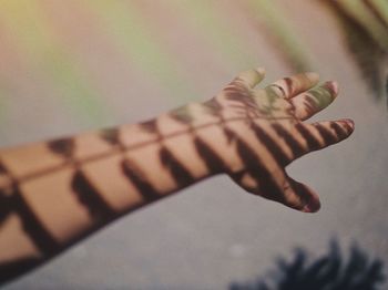 Cropped hand of woman gesturing outdoors