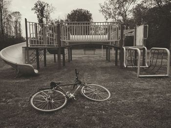 Bicycle in park against sky