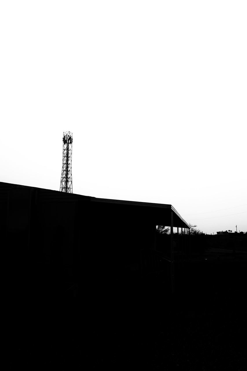 LOW ANGLE VIEW OF SILHOUETTE BUILDINGS AGAINST SKY