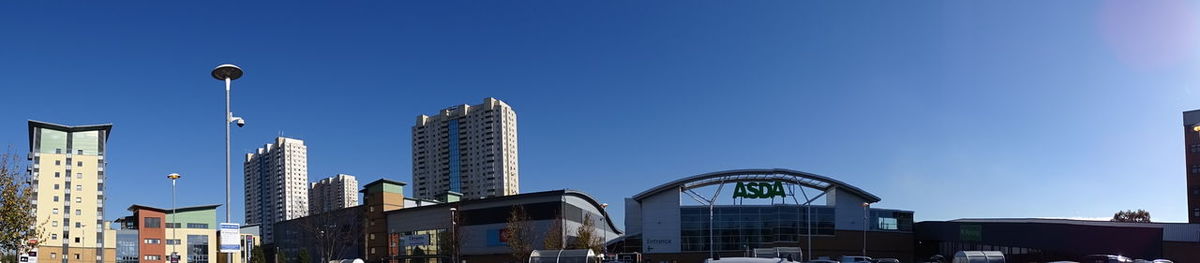 Low angle view of buildings against blue sky