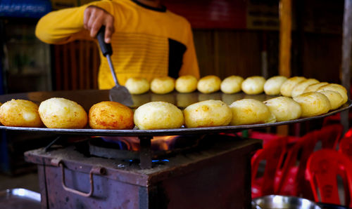 Midsection of man preparing food