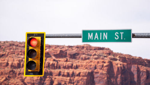 Close-up of road sign against clear sky