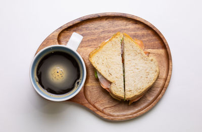 High angle view of breakfast on table against white background