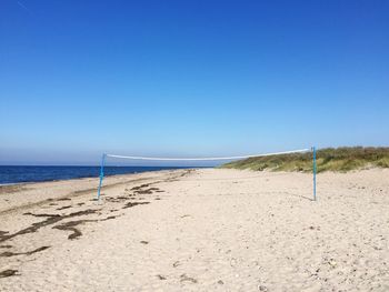 Scenic view of volletyball net on  beach