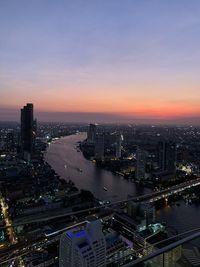 High angle view of illuminated buildings against sky during sunset in bangkok 