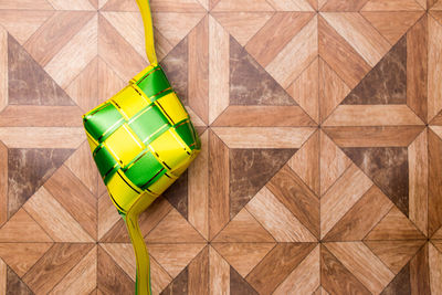 High angle view of multi colored umbrella on wood