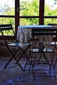 Chairs and table in window