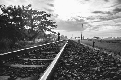 Surface level of railroad tracks against sky