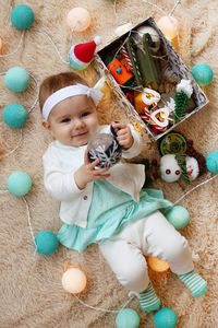 High angle portrait of cute baby toy at home