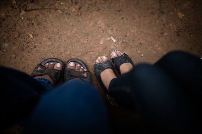 Low section of friends on footpath