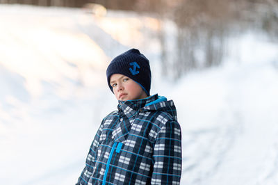 Portrait of a boy on a sunny winter day.