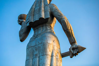 Low angle view of statue against clear blue sky