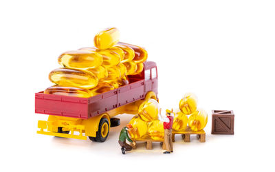 Close-up of yellow toy car against white background