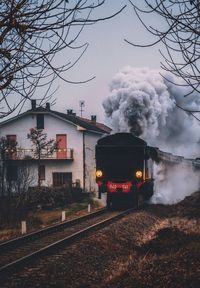 Train on railroad track against sky