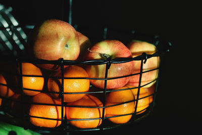 Close-up of orange fruits in basket