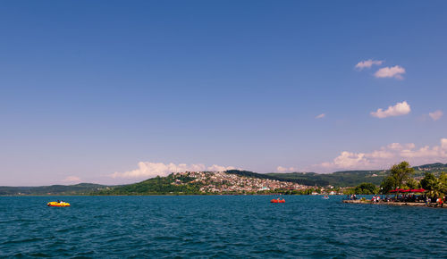 Scenic view of sea against blue sky