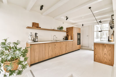 Modern kitchen in empty living room