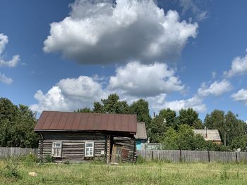 House on field against sky