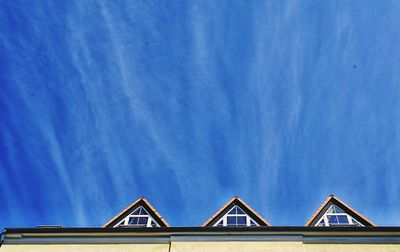 Low angle view of building against blue sky