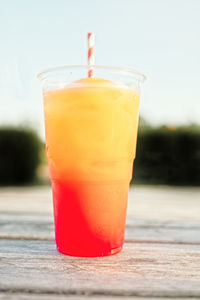 Close-up of orange juice on table