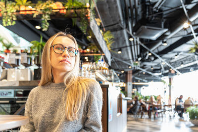 Portrait of young woman standing in gym
