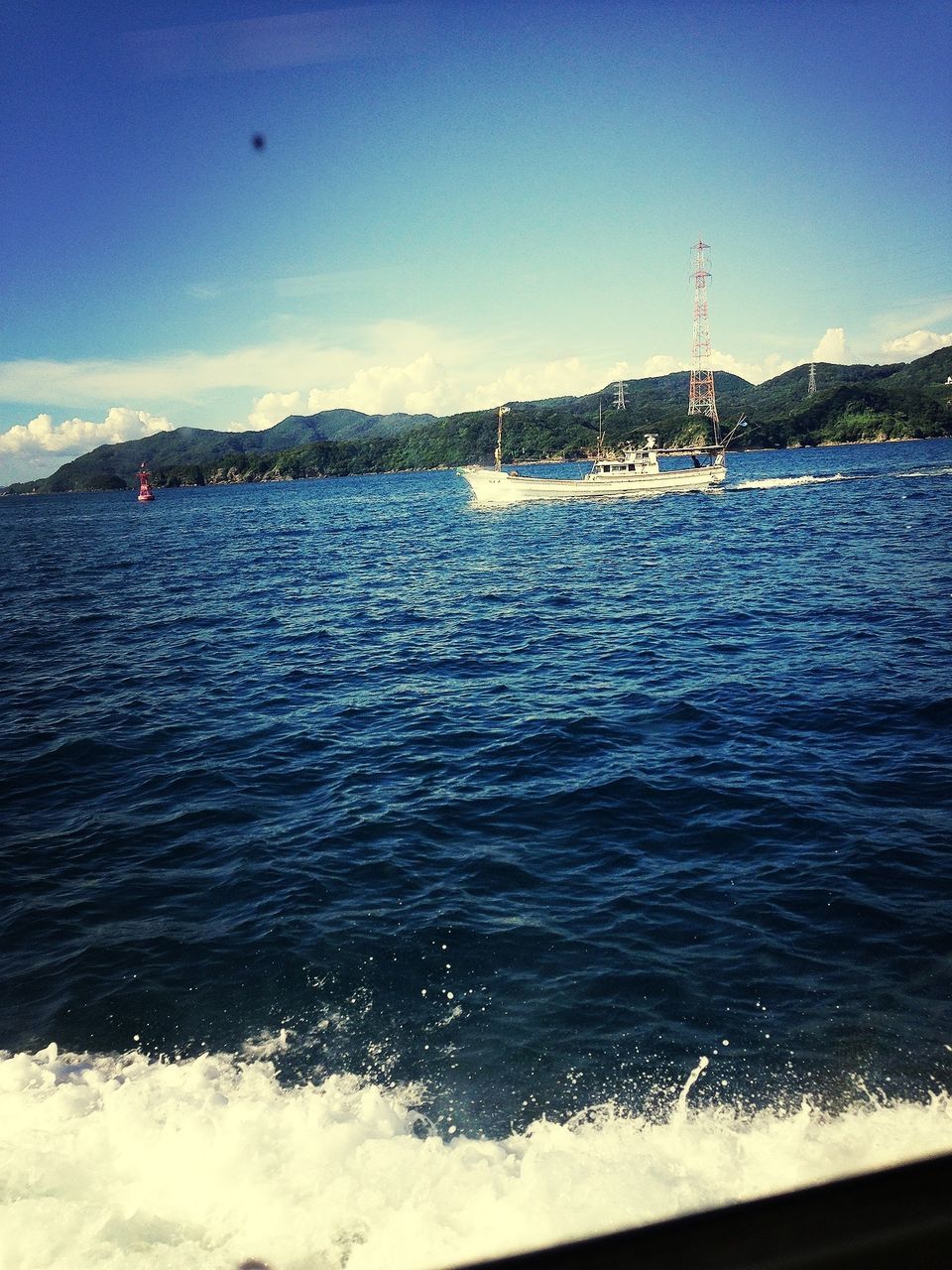 sea, water, transportation, nautical vessel, mode of transport, boat, blue, mountain, sky, scenics, sailing, nature, waterfront, beauty in nature, rippled, travel, sailboat, wave, tranquility, day