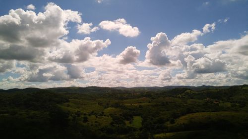 Scenic view of landscape against cloudy sky