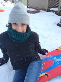 Woman wearing hat in snow during winter