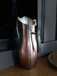 Close-up of water of jar on table