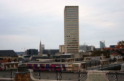 Modern buildings in city against sky