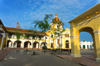 Church in city against sky