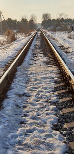 Surface level of snow covered railroad tracks