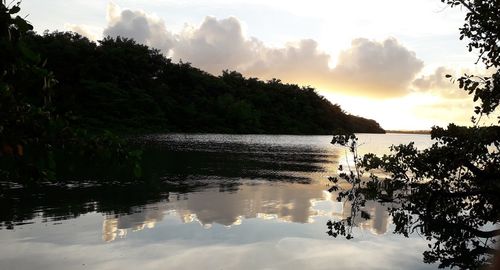 Scenic view of lake against sky during sunset