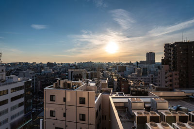 High angle view of buildings against sky during sunset