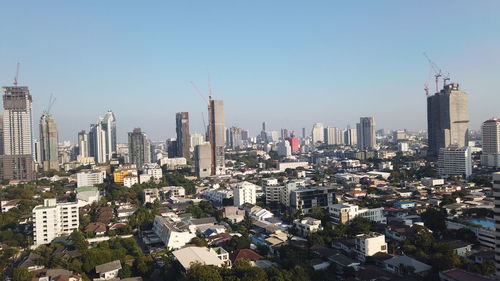 Aerial view of modern buildings against clear sky