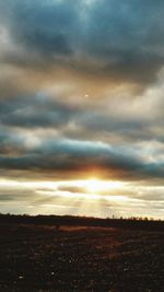 Scenic view of landscape against cloudy sky