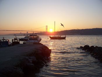 Scenic view of sea against clear sky during sunset