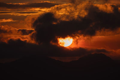 Scenic view of dramatic sky during sunset