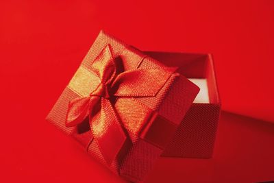 Close-up of gift box against yellow background