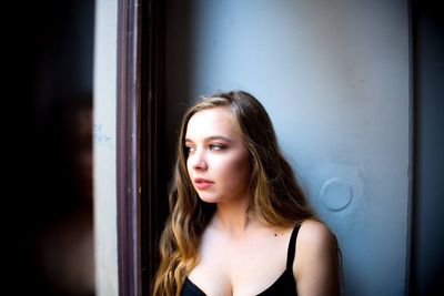 Portrait of a beautiful young woman looking away