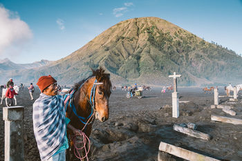 TOURISTS ON MOUNTAIN PEAK