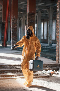 Rear view of man walking on street