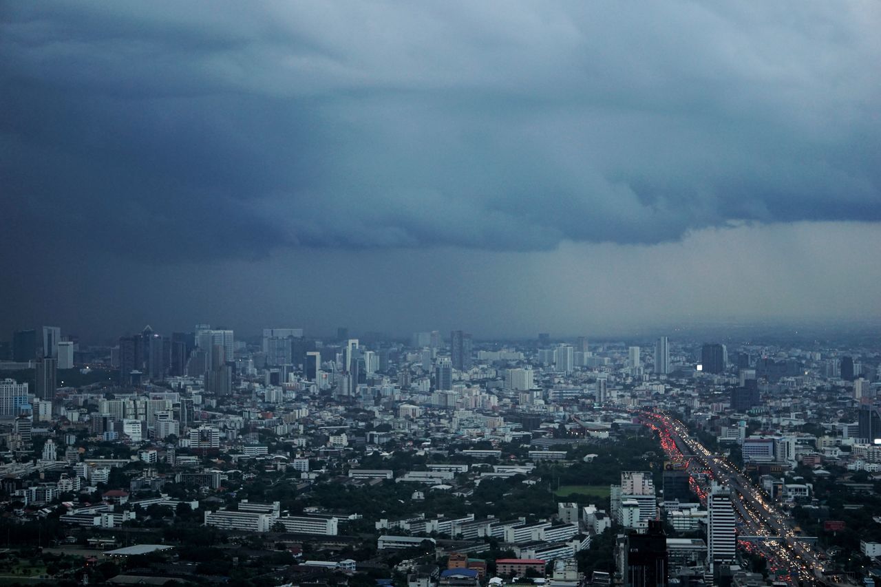 cloud - sky, cityscape, building exterior, city, sky, architecture, built structure, crowd, building, nature, crowded, residential district, overcast, outdoors, landscape, high angle view, skyscraper, community, office building exterior, ominous, settlement