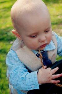 Close-up of cute boy holding smart phone