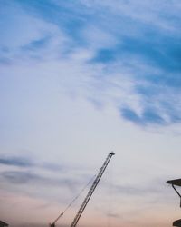 Low angle view of telephone pole against sky