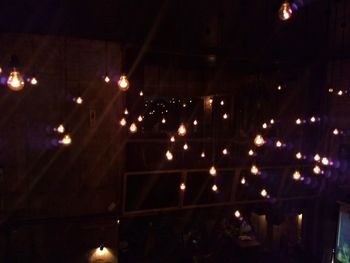 Low angle view of illuminated restaurant at night